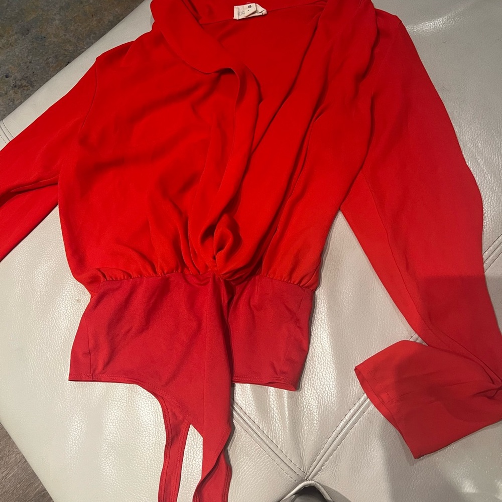 Xs long sleeve bodysuit in red.